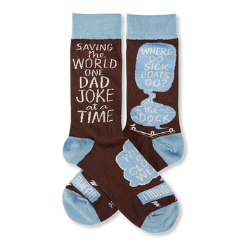 Pair of brown crew socks with light blue cuffs, heels, and toes. White text reads "SAVING THE WORLD ONE DAD JOKE at a TIME" and "WHERE DO SICK BOATS GO? the DOCK" inside speech bubbles.