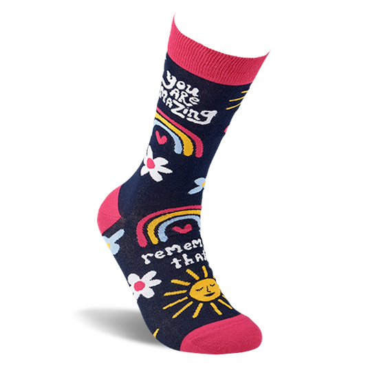 Single dark blue crew sock with pink accents, shaped to fit a foot, showing positive messages and cheerful patterns.