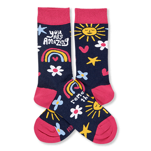 Pair of dark blue crew socks with pink cuffs, heels, toes. Features smiling suns, rainbows, flowers, stars, and 'YOU ARE AMAZING' text.