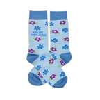 Pair of light blue crew socks with scattered blue and purple flowers. One sock reads "YOU ARE MOM-AZING" in green text.