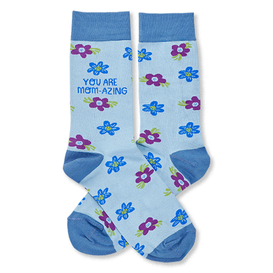 Pair of light blue crew socks with scattered blue and purple flowers. One sock reads 