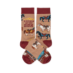 Pair of tan crew socks with reddish-brown cuffs, heels, and toes, featuring colorful horses, a barn, and 'I'd Rather Be At The Barn' text.