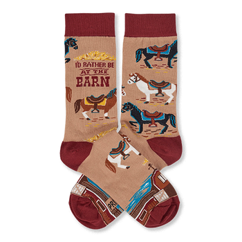 Pair of tan crew socks with reddish-brown cuffs, heels, and toes, featuring colorful horses, a barn, and 'I'd Rather Be At The Barn' text.