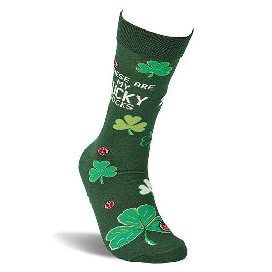 A single dark green crew sock stands upright, displaying green and white clovers, red ladybugs, and text.