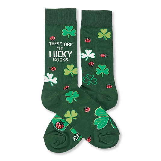 Pair of dark green crew socks with light green and white clovers and red ladybugs. One sock reads 