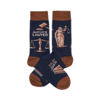 Pair of navy crew socks with brown cuffs, heels, and toes. Design includes "Awesome Lawyer" text, gavels, Lady Justice, and scales.