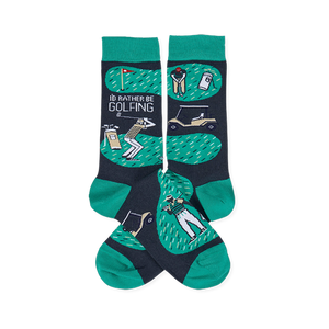 A pair of crew socks with a dark grey and green golf theme. Design includes golfers, a golf cart, flag, and 