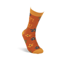 Single rust-orange crew sock with yellow cuff, heel, and toe, worn on an invisible foot. Text 'FUN FACT... I DON'T CARE' and scattered flowers are visible from the side.