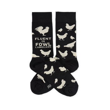 Two black crew socks with white chicken illustrations and "Fluent In Fowl Language" text, laid flat against a white background.