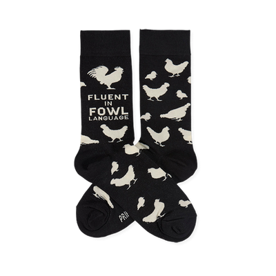 Two black crew socks with white chicken illustrations and "Fluent In Fowl Language" text, laid flat against a white background.