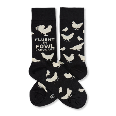 Two black crew socks with white chicken illustrations and "Fluent In Fowl Language" text, laid flat against a white background.