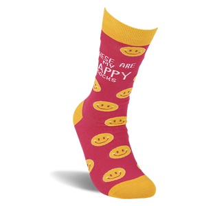 Single pink crew sock with yellow smiley faces standing upright on a white background. Yellow cuff, heel, and toe.