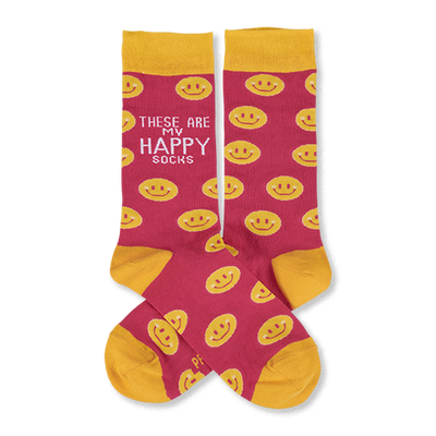Pair of pink crew socks with yellow smiley faces. Yellow cuffs, heels, and toes. One sock features 'These Are My Happy Socks' text.