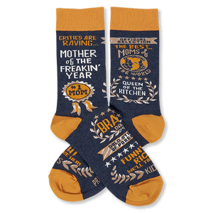 Pair of navy crew socks with orange cuffs, heels, and toes, featuring gold and white text graphics like 'Mother Of The Freakin' Year'.