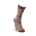 A single greyish-brown crew sock, worn on a foot, featuring mushrooms, leaves, and snails. Dark brown cuff, heel, and toe.