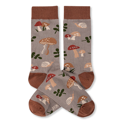 Two crew socks with a greyish-brown background, featuring a pattern of brown and red mushrooms, green leaves, and snails. Dark brown cuffs, heels, and toes.