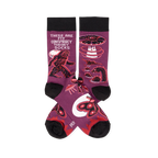 Pair of purple crew socks with black cuffs, heels, and toes, featuring Bigfoot, UFOs, aliens, and Mothman designs.
