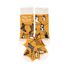 Pair of mustard yellow crew socks with off-white cuffs, heels, and toes, featuring a clothesline pattern with various small socks and the phrase 'THESE ARE MY ONLY CLEAN SOCKS'.