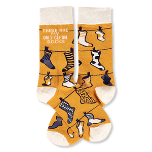 Pair of mustard yellow crew socks with off-white cuffs, heels, and toes, featuring a clothesline pattern with various small socks and the phrase 'THESE ARE MY ONLY CLEAN SOCKS'.