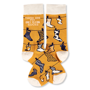 Pair of mustard yellow crew socks with off-white cuffs, heels, and toes, featuring a clothesline pattern with various small socks and the phrase 'THESE ARE MY ONLY CLEAN SOCKS'.