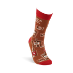 Single brown crew sock with red cuff, heel, and toe on a foot form, showing whiskey bottles and glasses pattern.