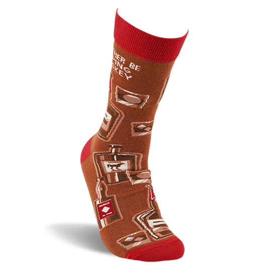 Single brown crew sock with red cuff, heel, and toe on a foot form, showing whiskey bottles and glasses pattern.