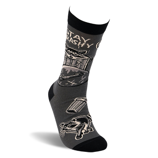 Side view of a single dark gray crew sock with black details, showing a raccoon in a trash can and 'STAY TRASHY' text.