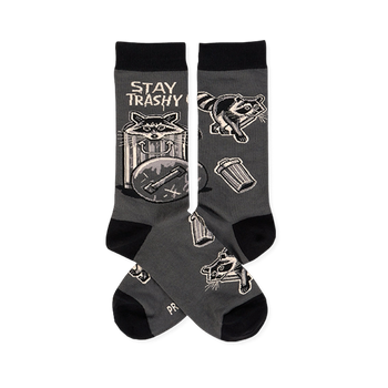 Pair of dark gray crew socks with black cuffs, heels, toes. Features raccoons, trash cans, and 'STAY TRASHY CREW' text.