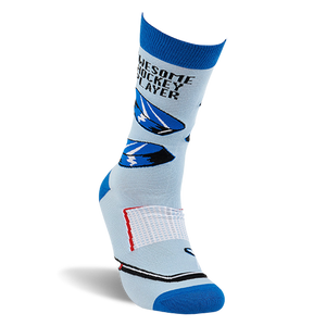 Single light blue crew sock, angled view. Shows black hockey pucks, net, stick, and 