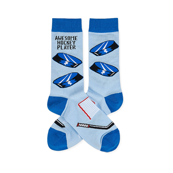 Light blue crew socks with blue cuffs, heels, toes. Features hockey pucks, net, stick, and 