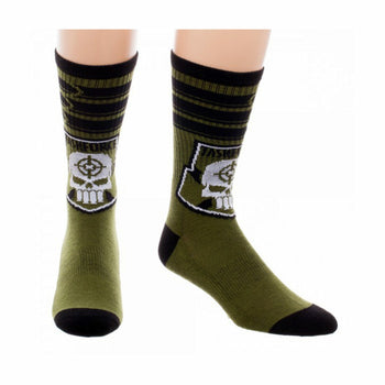 Crew socks in olive green and black, featuring a white skull logo with crosshairs inside a black patch and Taskforce X text.