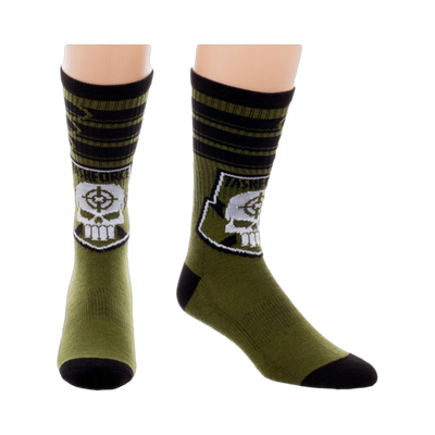 Crew socks in olive green and black, featuring a white skull logo with crosshairs inside a black patch and Taskforce X text.