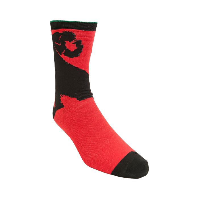 Lifestyle shot of the red and black Wind Waker themed socks on a person's feet.
