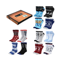 Product shot of The Office 12 Days of Socks Box Set. Features crew and ankle socks in red, gray, blue, and black with The Office logos and quotes.