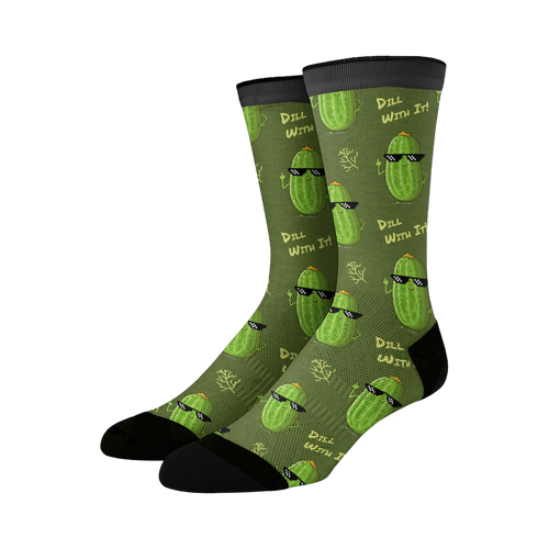 Crew socks in olive green with a repeating pattern of cartoon pickles wearing sunglasses and the phrase 'Dill With It'.