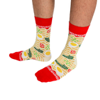 Close-up of a person's legs wearing the ramen crew socks, standing on a white background.