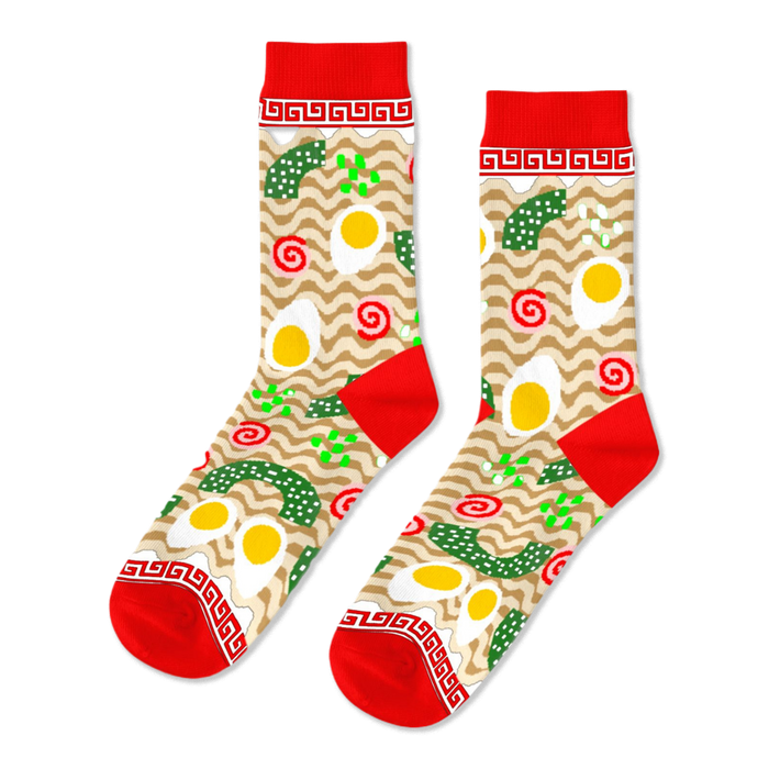 Pair of crew socks with a ramen noodle and fried egg pattern on a beige background, with red cuffs, heels, and toes.