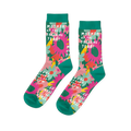 Pair of crew socks with pink, orange, and yellow flowers on a green background and teal cuffs, heels, toes.