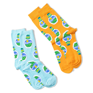 Two pairs of socks, one orange and one light blue, both with a ranch dressing bottle pattern, laid flat on black.