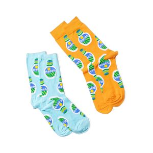 Two pairs of socks, one orange and one light blue, both with a ranch dressing bottle pattern, laid flat on black.