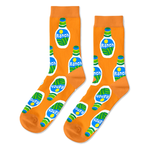 A pair of bright orange crew socks with an all-over repeating pattern of white ranch dressing bottles with green and blue accents.