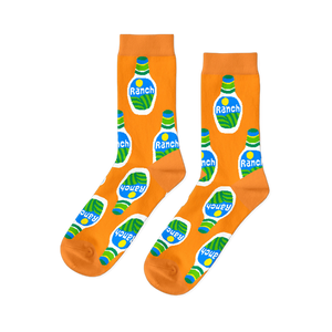 A pair of bright orange crew socks with an all-over repeating pattern of white ranch dressing bottles with green and blue accents.