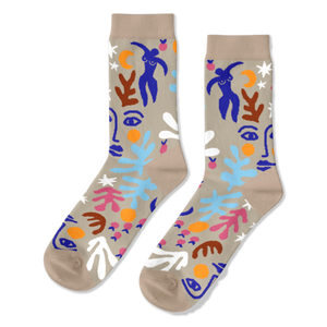 Pair of crew socks with an abstract Matisse-inspired pattern featuring blue figures, faces, stars, and leaves on a tan background.