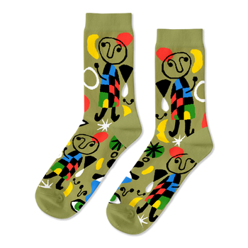 Pair of olive green crew socks with abstract art pattern, featuring stick figures, red stars, yellow moons, and colorful geometric shapes.