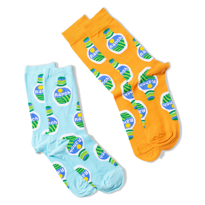 Two pairs of ranch dressing bottle socks are displayed, one pair is light blue, and the other is orange.