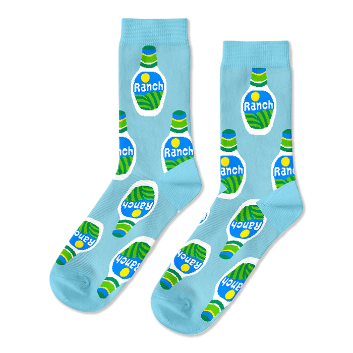A pair of light blue crew socks with a repeating pattern of white ranch dressing bottles on a black background.