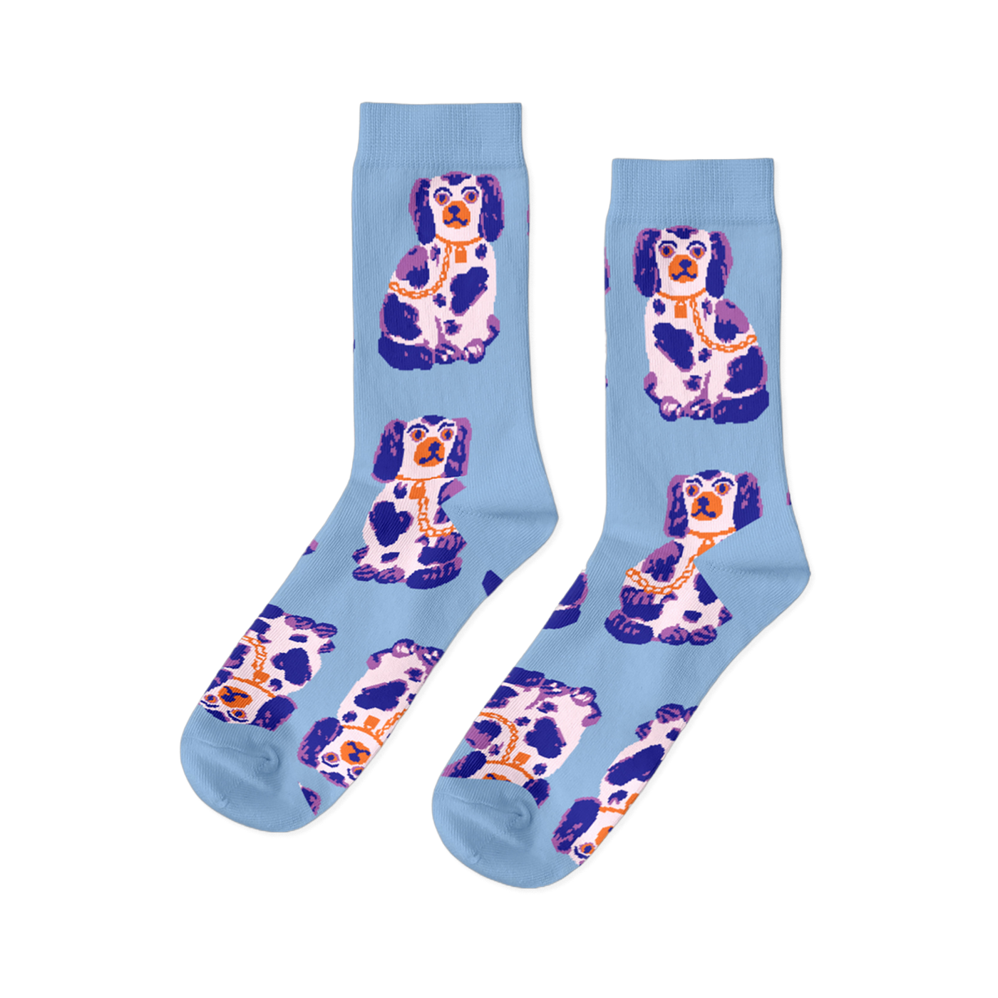 Pair of light blue crew socks, patterned with sitting white, dark blue, and purple Staffordshire dog figurines wearing gold chains.
