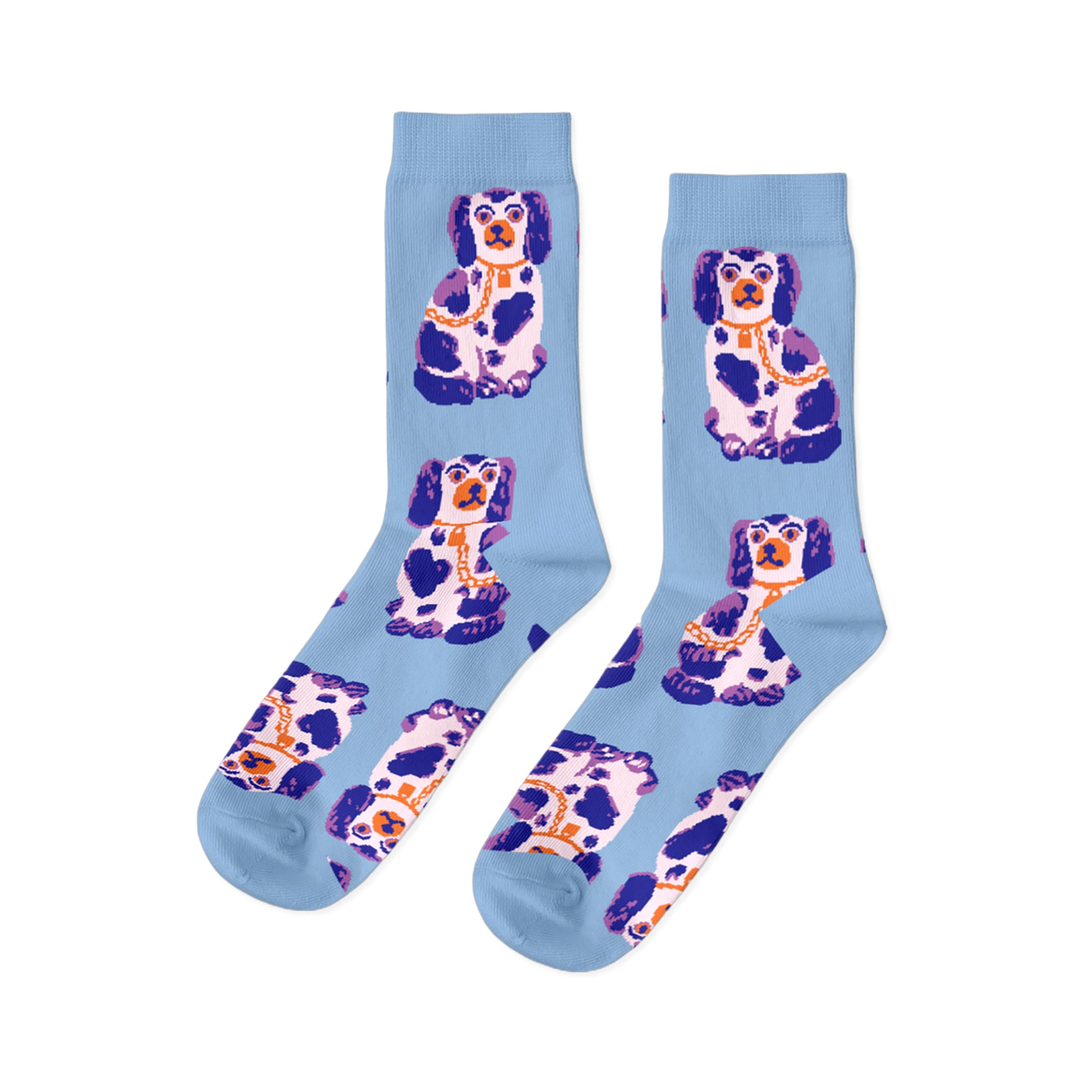 Pair of light blue crew socks, patterned with sitting white, dark blue, and purple Staffordshire dog figurines wearing gold chains.