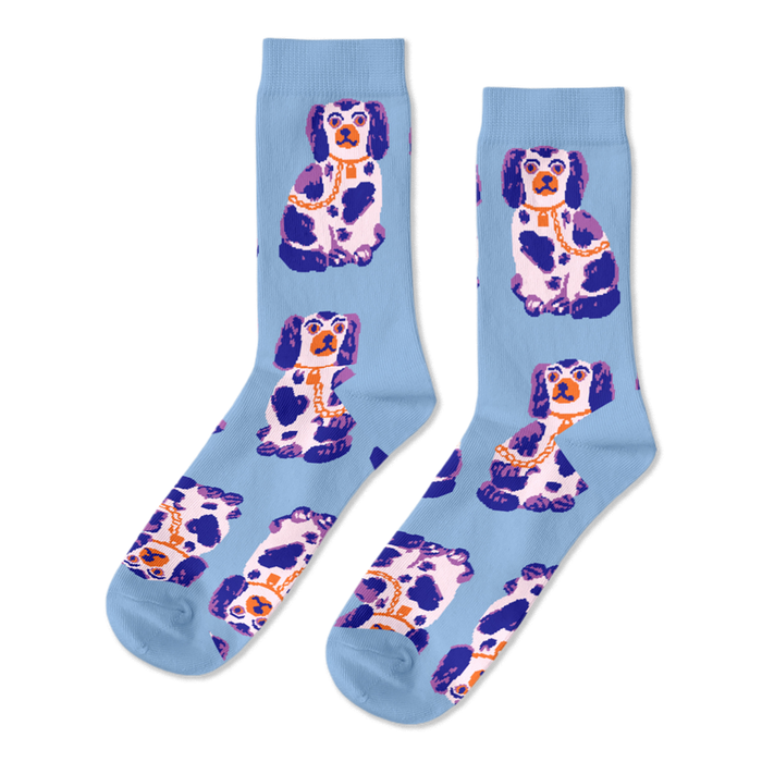 Pair of light blue crew socks, patterned with sitting white, dark blue, and purple Staffordshire dog figurines wearing gold chains. }}