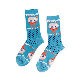 Pair of teal crew socks with dark blue polka dots. Features a light peach cat face, orange bow, and 'FUCK IT' text.